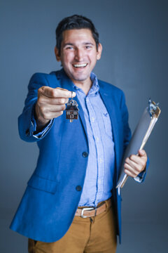 New Home Owner get the Key of his new Home from the real estate agent