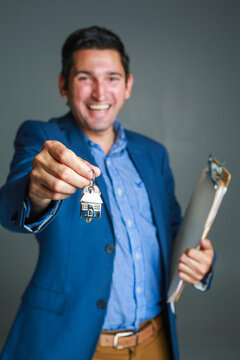 New Home Owner get the Key of his new Home from the real estate agent