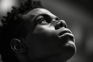 Black and white portrait of a fit African American gazing upward