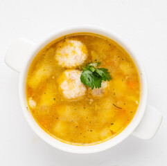 soup with meatballs on white background