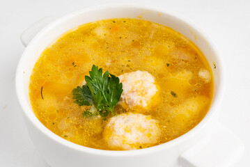 soup with meatballs on white background