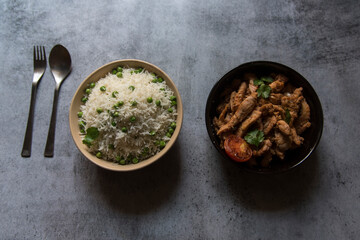 Popular lunch ingredient green peas rice and fried chicken. Top view, selective focus.