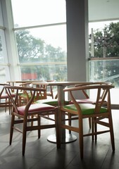 colorful wooden chairs on the balcony with city views