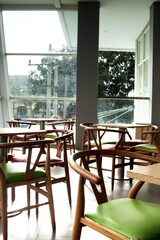 colorful wooden chairs on the balcony with city views