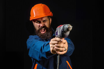 Builder worker in construction helmet. Builder foreman or repairman in builders uniform. Worker in...