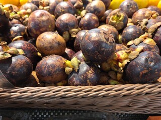 Healthy and neatly arranged mangosteen fruit for sale in supermarkets, fresh fruit background