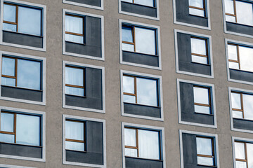 A fragment of the facade of a multi-storey residential building on a winter day