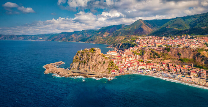 Aerial summer view from flying drone of Reggio Calabria, Italy, Europe. Astonishing morning cityscape of Scilla port. Spectacular seascape of Mediterranean sea. Traveling concept background.
