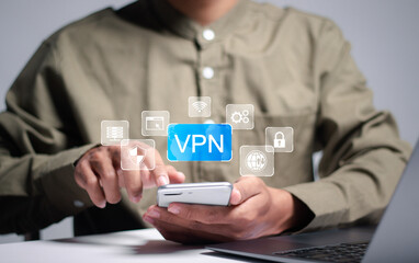 VPN Virtual Private network protocol concept, Person using smartphone and laptop with VPN icon for connect to VPN network on virtual screen.