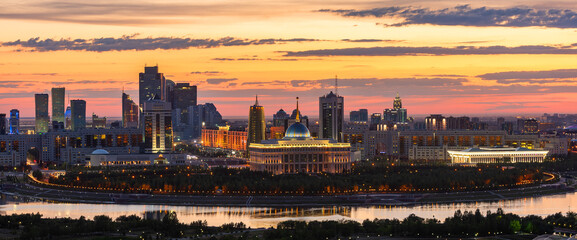 Beautiful sunset over the central part of the capital of Kazakhstan, Astana - obrazy, fototapety, plakaty