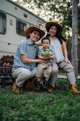 happy harmonious Asian family outdoors concept, Asian mother and son have activities happy fun together on holidays, grass land with sunlight