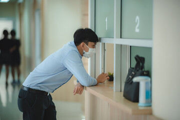 Male Patient is getting medicine or drug from pharmacist at the pharmacy counter or office from...