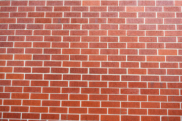 Fototapeta premium Surface of brickwall. Textured brown backdrop. Wall texture background. Brick wall structure. Brick masonry background. Building material concept. Exposed brickwork