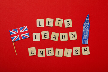 The phrase "let's learn English" on a red background.