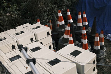 Roadblocks and building materials piled in an open space