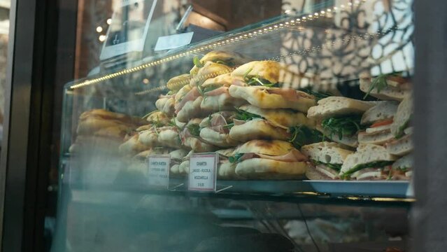 Venetian window display of typical assorted sandwiches