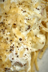 Carbonara pasta with cream and cheese in a plate