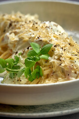 Carbonara pasta with cream and cheese in a plate