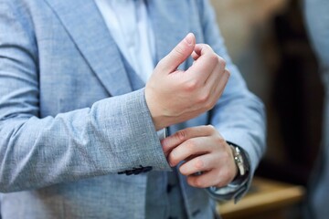 Men's hands with watches. Classic clothes. Men's accessories