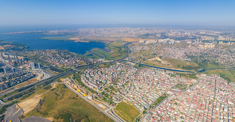 Fototapeta na wymiar Istanbul, Turkey. Summer panorama of the city from the air on a sunny day. Dormitory and industrial areas of the city. District of Ikitelli. Aerial View