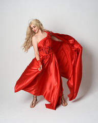 Full length portrait of  blonde model dressed as ancient mythological fantasy goddess in flowing...