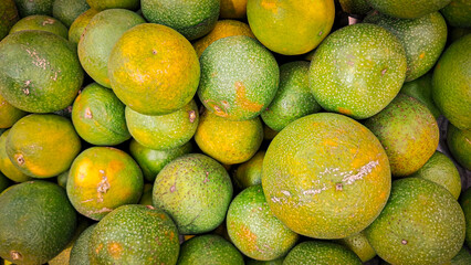 Green and yellow colour orange .orange .fresh and raw orange 