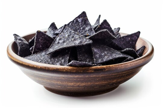 Isolated on a white surface a bowl of crispy blue corn chips