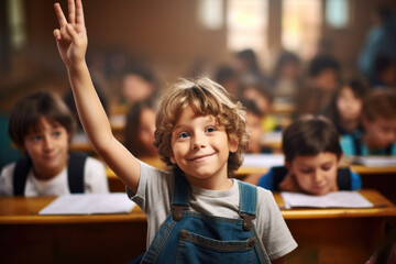Fototapeta premium Young boy in classroom raising his hand. Suitable for educational and school-related concepts
