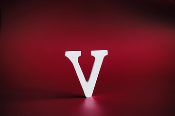 WAR, word written in wooden alphabet letters on red background. The concept of a terrible war...