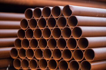 Pile of rusted steel pipes. selective focus