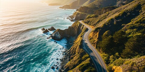 A coastal highway with sheer cliffs on one side and a turquoise ocean on the other, as the sun rises over the water - obrazy, fototapety, plakaty