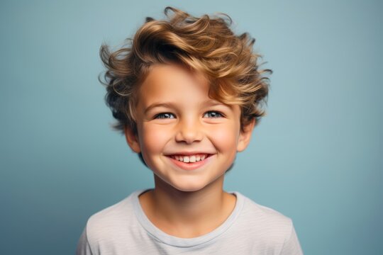 Close-up picture of a sweet 5-year-old Caucasian boy, showcasing a content smile on his face against a calming pastel solid space