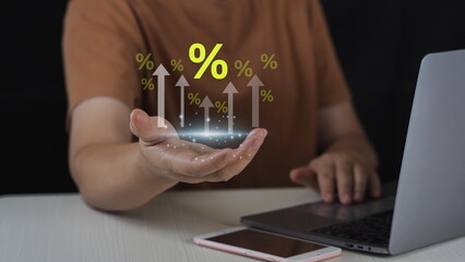 Interest rate and dividend concept, Person holding virtual percentage icon with up arrow