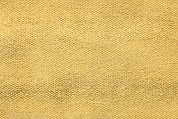 Texture of soft yellow fabric as background, top view