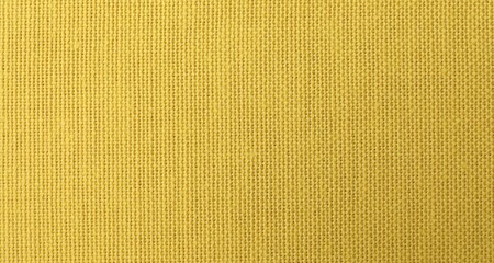 Texture of yellow fabric as background, top view