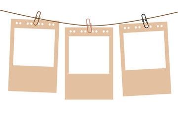 blank photo frames hanging on rope. photo collage template