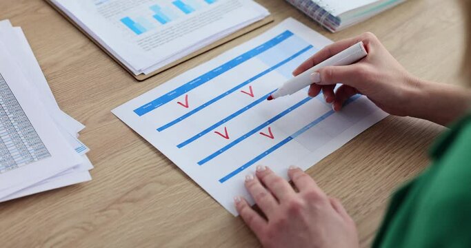 Woman ticks off places completed tasks and meetings on planner