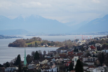 Horgen, hirzel, and halbinsel au with view on zurich see and the horgen church. Landscape...