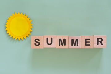 Summer season word typography in minimalist green backdrop with sun design.	