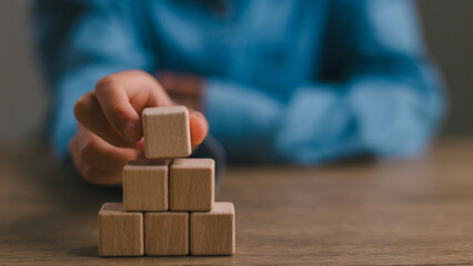 Blank wooden cubes on the table with copy space, empty wooden cubes for input wording, and an infographic icon.