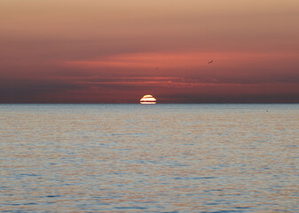 Sunrise over the Mediterranean Sea seen from the beach in Torremolinos. Costa del Sol, Spain