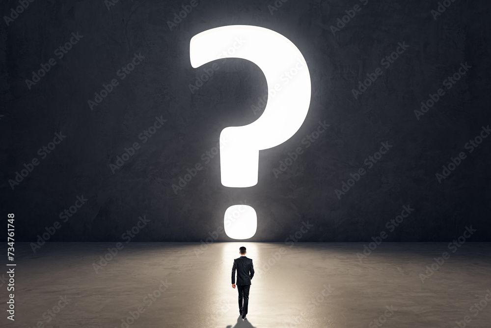 Poster back view of tiny business man in concrete room interior with huge bright question mark opening. dou
