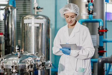 Professional QC staff work in science medical lab drinks beverage factory check record filter tank...