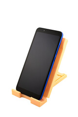 blue smartphone with blank screen on holder