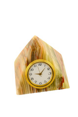 antique clock made of onyx stone in the shape of a pyramid