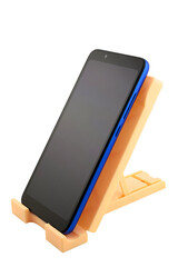 blue smartphone with blank screen on holder