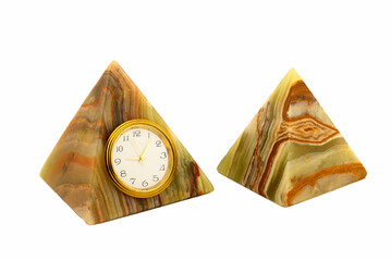 antique clock made of onyx stone in the shape of a pyramid