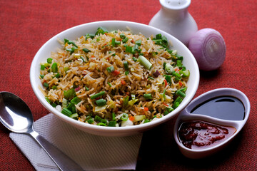 Chinese Cuisine - Fried Rice with Vegetables, fried rice in plate on table