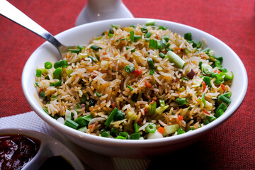 Chinese Cuisine - Fried Rice with Vegetables, fried rice in plate on table