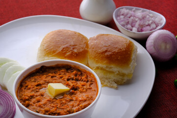 Pav bhaji is a fast food dish from India consisting of a thick vegetable curry served with bread.